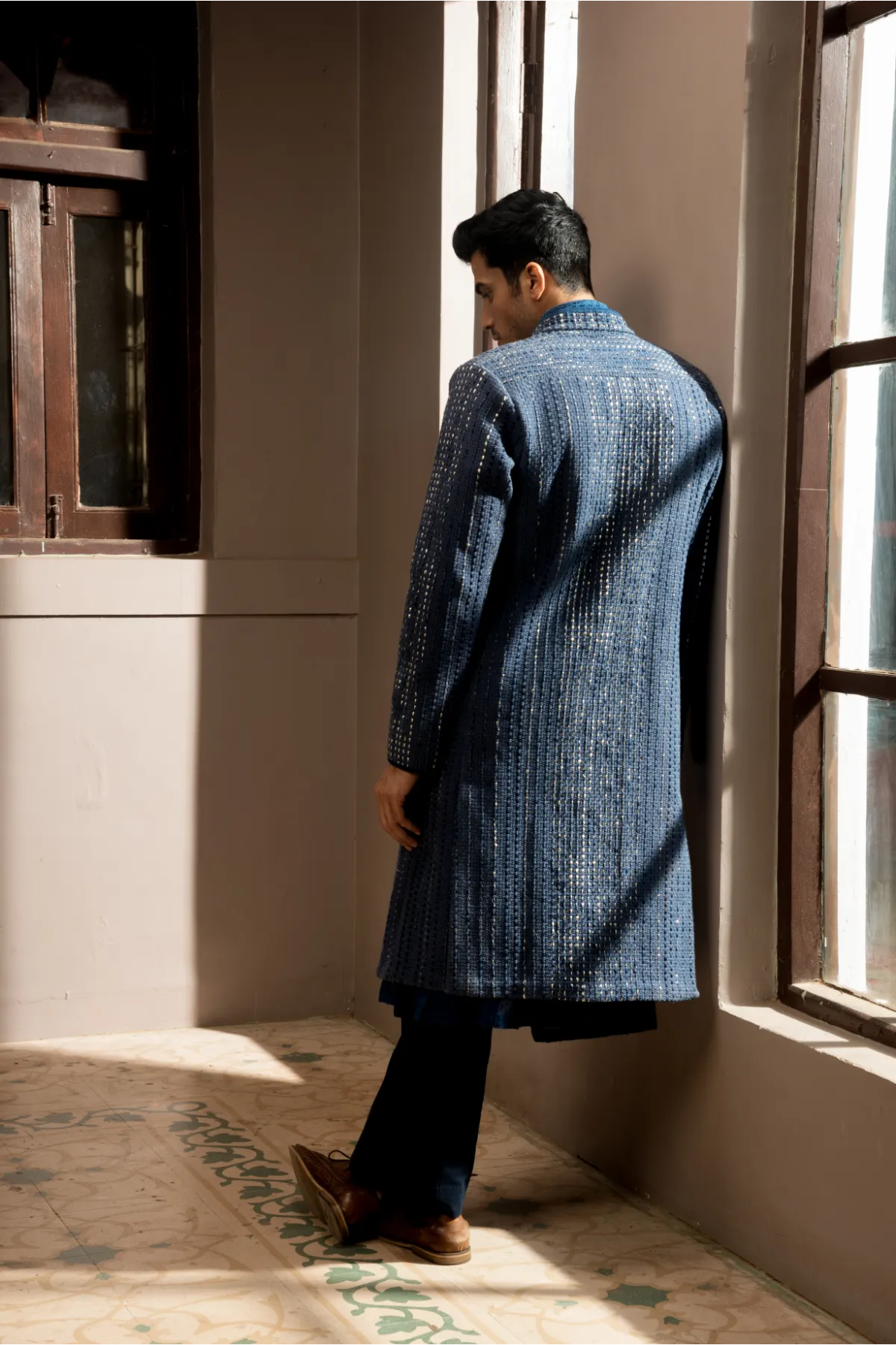 Dark blue textured sherwani with blue long kurta and pleated trousers