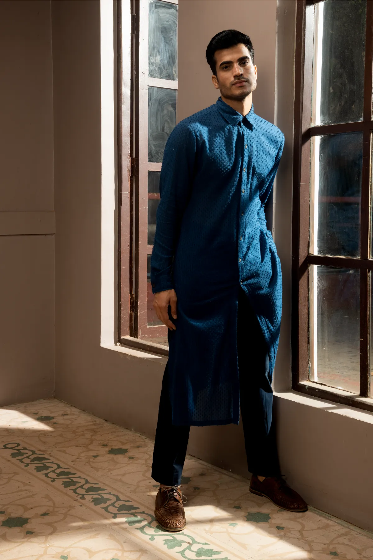 Dark blue textured sherwani with blue long kurta and pleated trousers